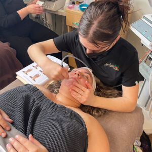 Student practicing DiamondGlow Microdermabrasion